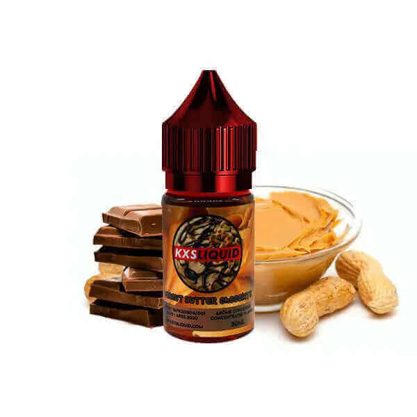 Flacon 30ml d'arÎme concentré KXS Liquid Peanut Butter Chocolate avec bouchon rouge, entouré de chocolat et beurre de cacahuÚte.