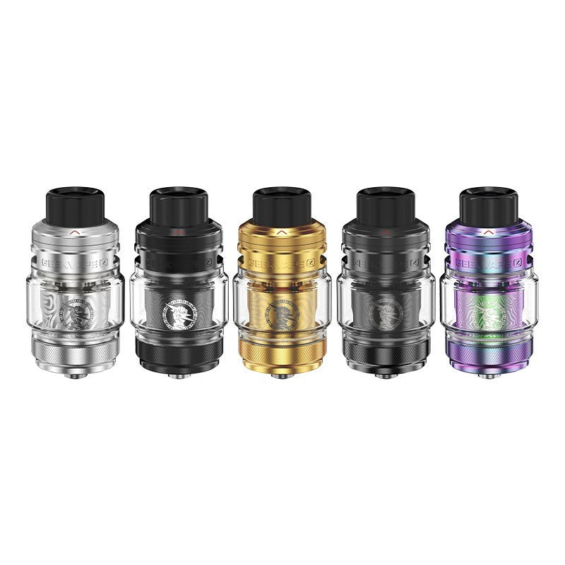 Clearomiseurs Geekvape Zeus Sub Ohm en cinq coloris métalliques avec réservoir en verre et logo gravé sur la résistance.